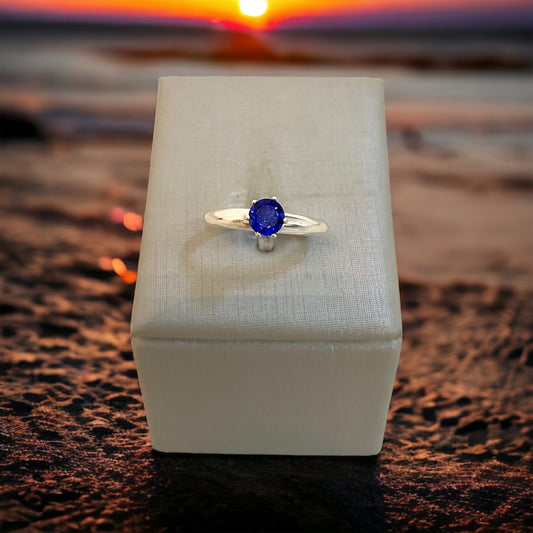 18kt white gold, six prong solitaire, natural royal blue sapphire