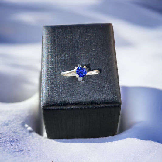 18kt White Gold four prong solitaire, royal blue sapphire ring